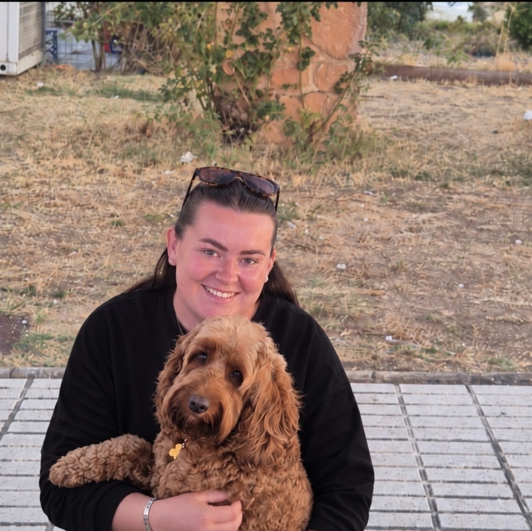 Freddie, a cockapoo, with his owner Tanya on the Costa del Sol