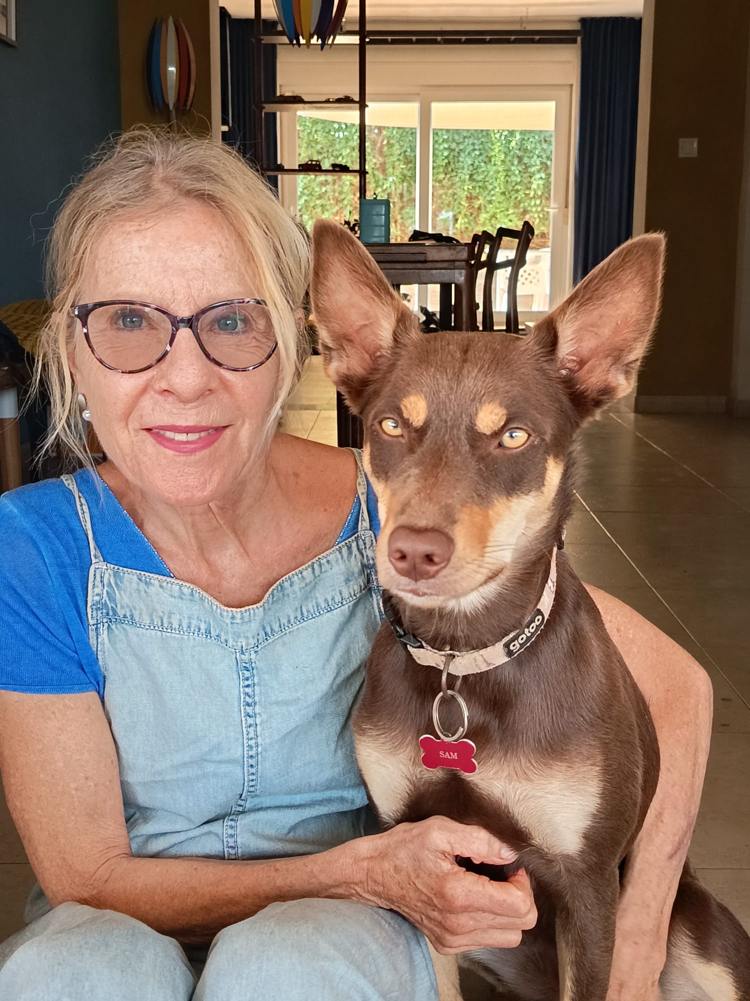 Adriana with Sam, an Australian Kelpie, at home and in the mountains